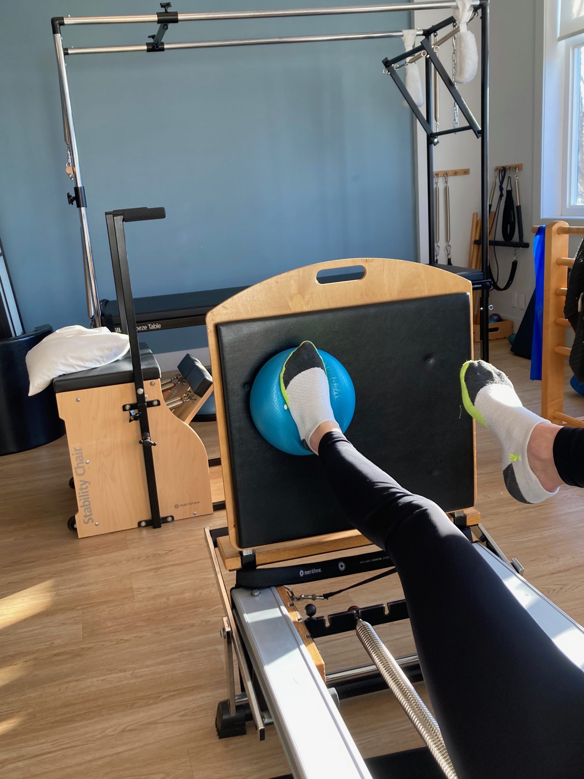 Footwork on Reformer Jumpboard Footwork on Pilates Reformer. Jumpboard with Foot on Ball